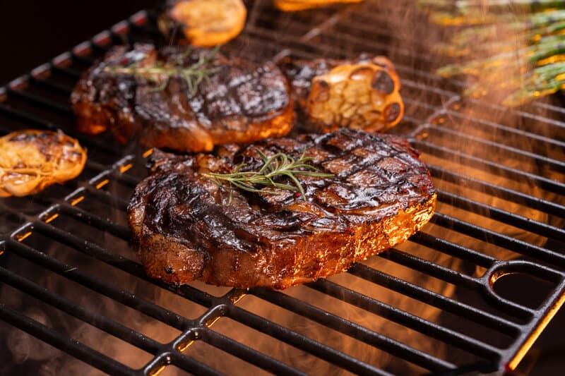 Rosemary Garlic Ribeye Steaks with Fire-Roasted Garlic