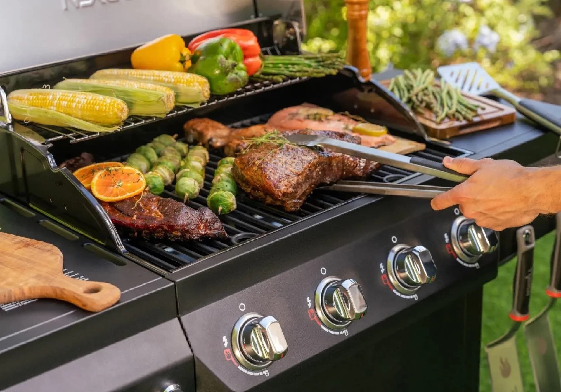 Nexgrill 4-Burner Propane Gas Grill in Black with Stainless Steal main lid