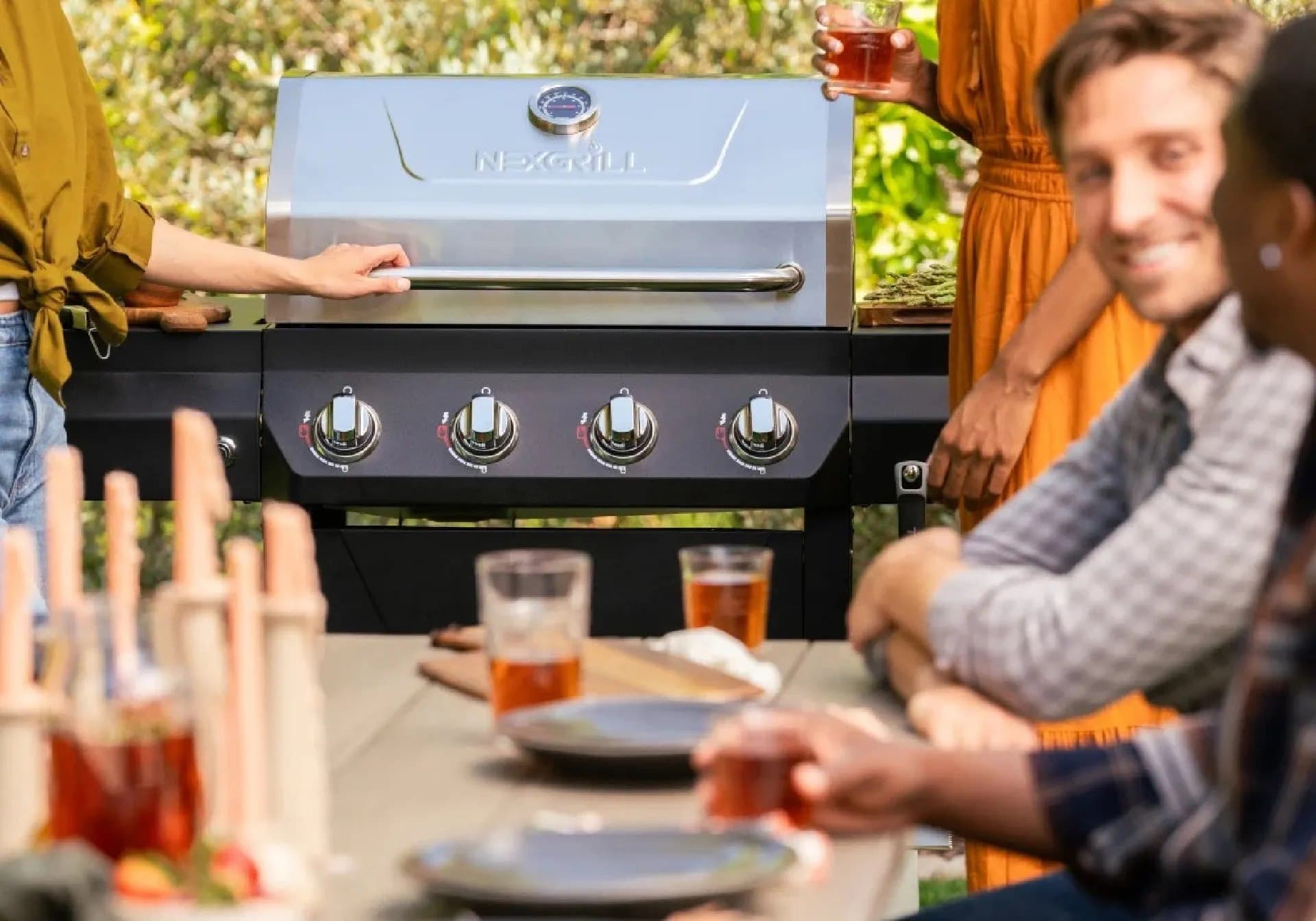 Nexgrill 4-Burner Propane Gas Grill in Black with Stainless Steal main lid