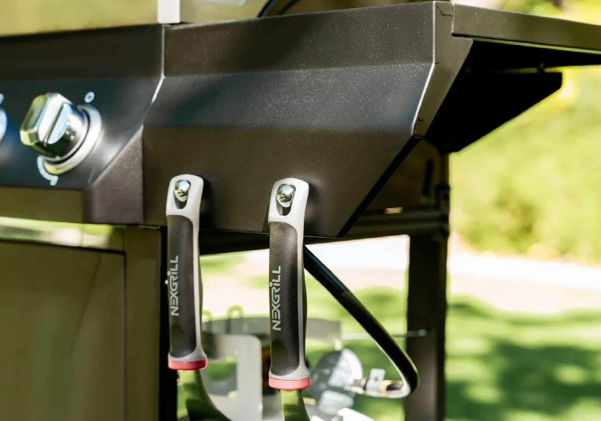 Nexgrill 4-Burner Propane Gas Grill in Black with Stainless Steal main lid